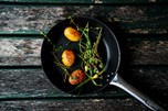 Roast potatoes with herbs in a pan