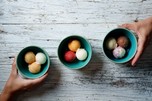 Three bowls with three scoops of ice cream in each