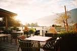 Tables on a terrace in atmospheric light
