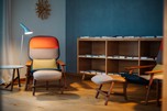 Cosy armchairs, shelves and a reading lamp