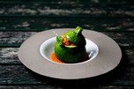 Stuffed round courgettes decorated on a plate