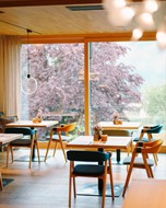 Tables in the restaurant in front of panoramic windows