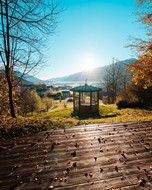 Terrace and pavilion in an autumn landscape