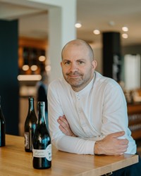 Christian Daberer with two bottles of wine