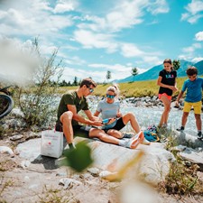 Family having a picnic on the riverbank