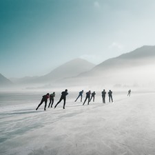 Group of people ice skating on the lake