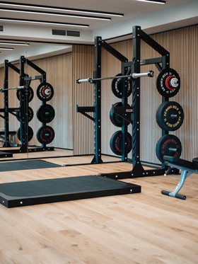Rack with weightlifting platform in the fitness room.