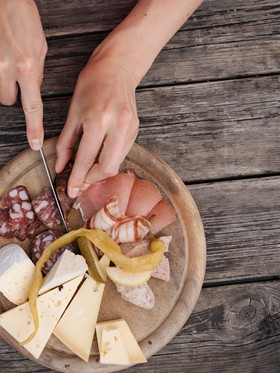 Snack board with ham, salami, cheese and bread