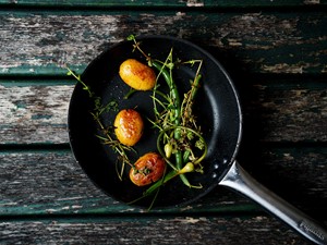 Roast potatoes with herbs in a pan