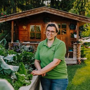 Farmer next to vegetable patch