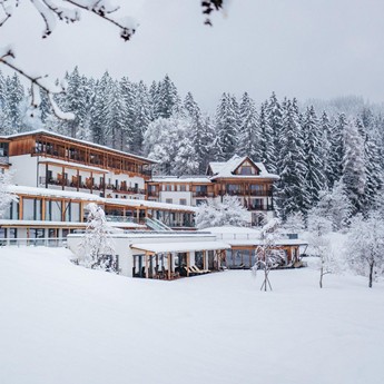 Go on holiday where tourism is quiet and unhurried Hotel Daberer from the outside in the snow