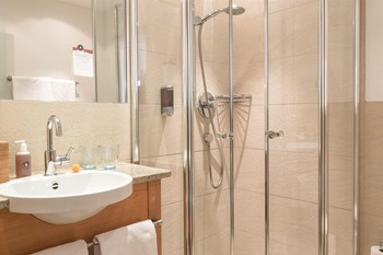 Washbasin and shower in the hotel bathroom