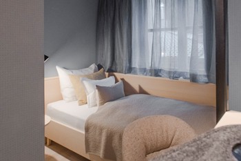 Single bed in a small hotel room