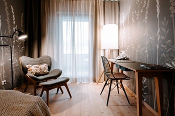 Cosy seating area and desk in the hotel room