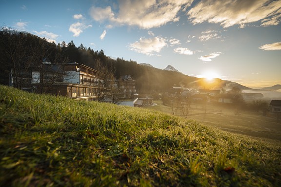 Hotel Daberer with meadows and trees in the surrounding area