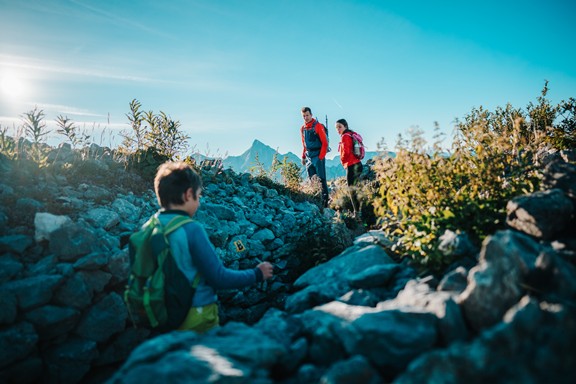 Family hiking on a rocky path